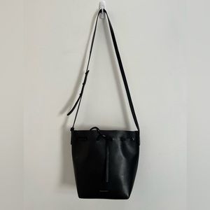 Mansur Gavriel black leather bucket bag with red interior